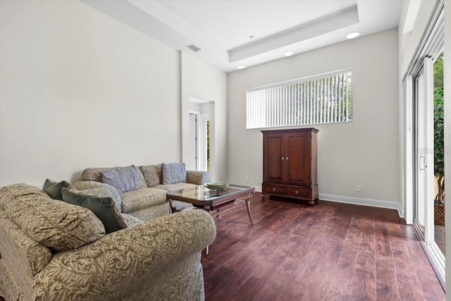 living room featuring recessed lighting, baseboards, visible vents, a towering ceiling, and dark wood-style floors