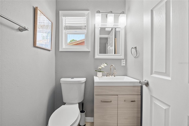 2525 Madrid Way S, Saint Petersburg, FL 33712 - half bathroom featuring toilet and vanity