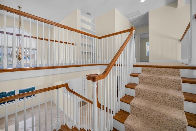 stairway featuring recessed lighting and visible vents