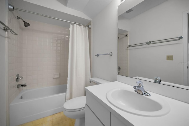 bathroom with shower / bath combo, toilet, vanity, and tile patterned floors