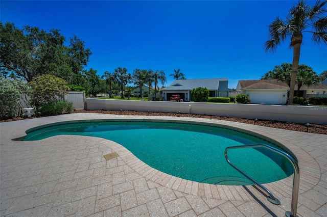 pool featuring a patio and fence