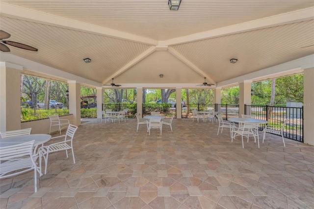 view of patio / terrace featuring fence, a ceiling fan, and outdoor dining space