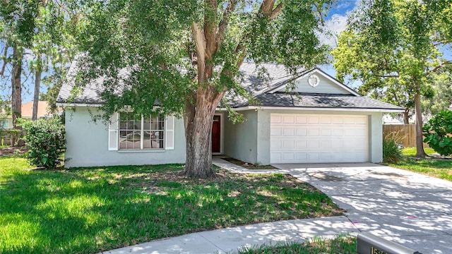 1530 High Knoll Dr, Brandon, FL 33511 - view of front of home featuring stucco siding, an attached garage, concrete driveway, and roof with shingles