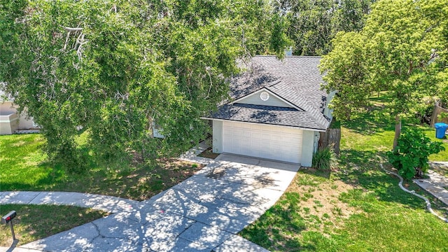 1530 High Knoll Dr, Brandon, FL 33511 - view of front of property featuring a shingled roof, stucco siding, driveway, and a front lawn