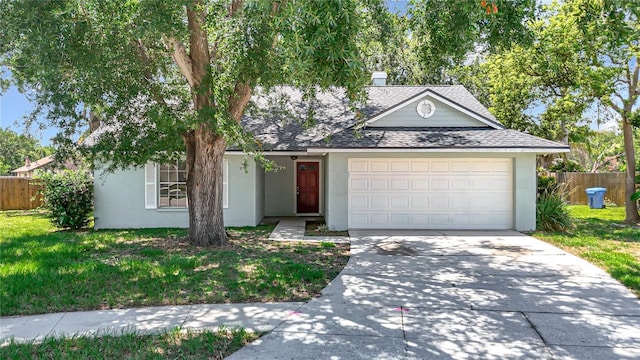 1530 High Knoll Dr, Brandon, FL 33511 - view of front of property featuring stucco siding, concrete driveway, an attached garage, and a shingled roof