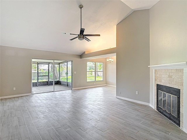 1530 High Knoll Dr, Brandon, FL 33511 - unfurnished living room with ceiling fan, wood finish floors, a brick fireplace, a chandelier, and high vaulted ceiling