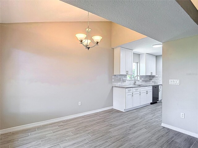1530 High Knoll Dr, Brandon, FL 33511 - kitchen with dishwasher, light wood-style flooring, tasteful backsplash, white cabinets, and a chandelier