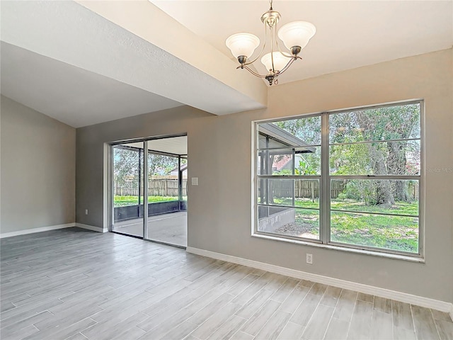 1530 High Knoll Dr, Brandon, FL 33511 - empty room featuring light wood finished floors, a chandelier, and plenty of natural light