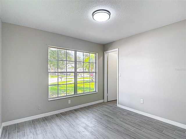 1530 High Knoll Dr, Brandon, FL 33511 - empty room with wood finished floors and a textured ceiling