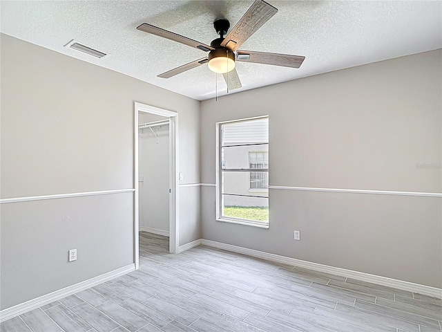 1530 High Knoll Dr, Brandon, FL 33511 - empty room featuring a ceiling fan, a textured ceiling, and wood finished floors