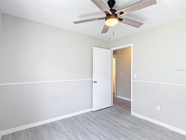 1530 High Knoll Dr, Brandon, FL 33511 - spare room featuring a ceiling fan, a textured ceiling, and wood finish floors