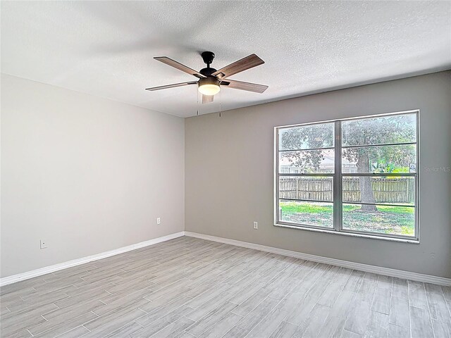 1530 High Knoll Dr, Brandon, FL 33511 - empty room featuring light wood-type flooring, a ceiling fan, and a textured ceiling