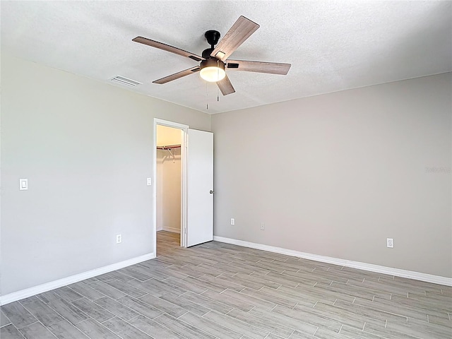 1530 High Knoll Dr, Brandon, FL 33511 - empty room featuring ceiling fan, light wood-style floors, and a textured ceiling