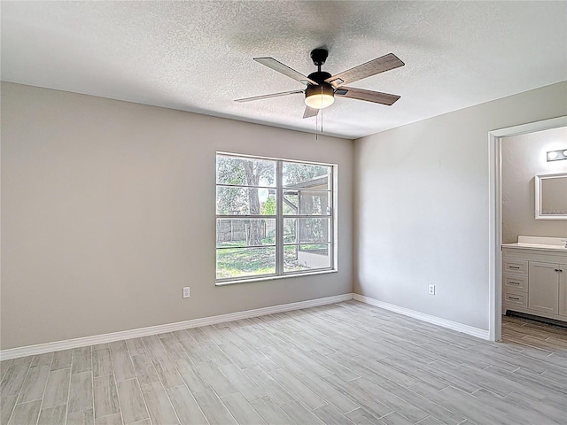 1530 High Knoll Dr, Brandon, FL 33511 - empty room featuring a textured ceiling, light wood-style floors, and ceiling fan