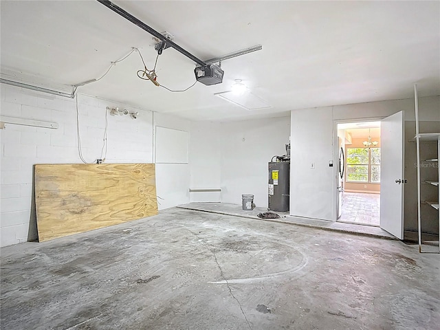 1530 High Knoll Dr, Brandon, FL 33511 - garage featuring water heater, a garage door opener, and freestanding refrigerator