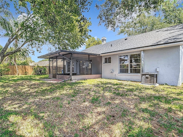 1530 High Knoll Dr, Brandon, FL 33511 - rear view of property featuring a sunroom, stucco siding, and a shingled roof