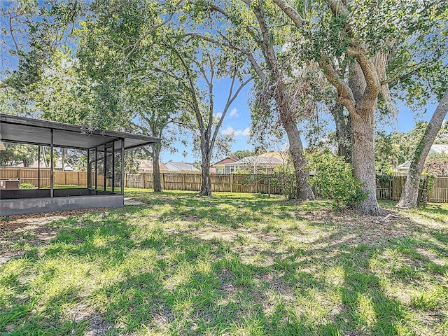 1530 High Knoll Dr, Brandon, FL 33511 - fenced backyard with a sunroom