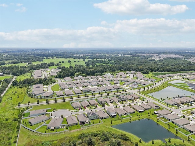 7323 Steer Blade Dr, Zephyrhills, FL 33541 - aerial perspective of suburban area with a large body of water