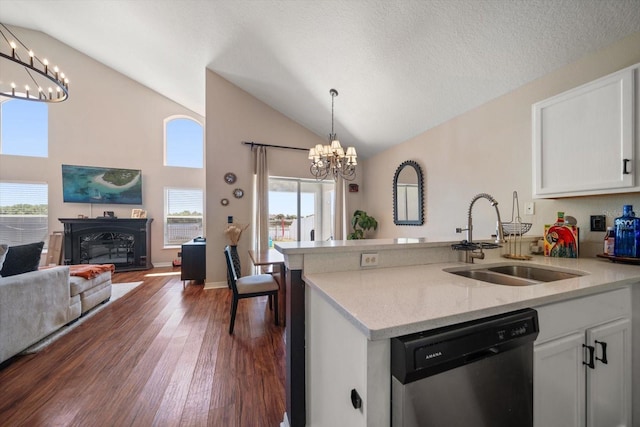 kitchen with a sink, a chandelier, dishwasher, dark wood finished floors, and white cabinetry