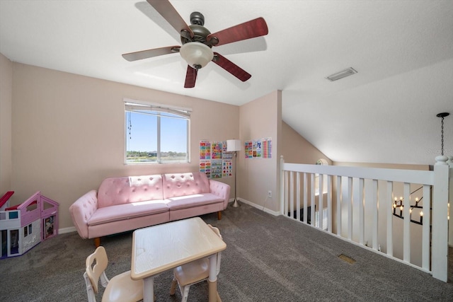 living area with carpet flooring, baseboards, visible vents, lofted ceiling, and ceiling fan