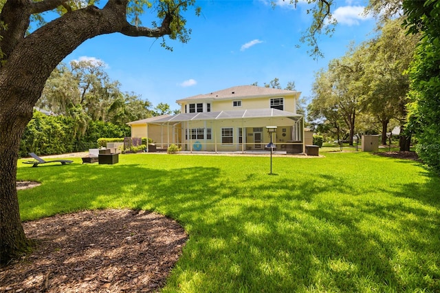 5902 Audubon Manor Blvd, Lithia, FL 33547 - rear view of house featuring a lawn, a patio, and an outdoor living space