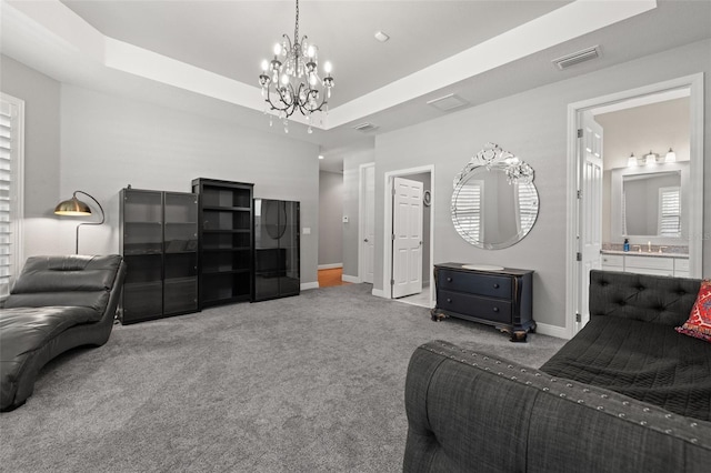 5902 Audubon Manor Blvd, Lithia, FL 33547 - bedroom featuring carpet, a chandelier, baseboards, and a tray ceiling