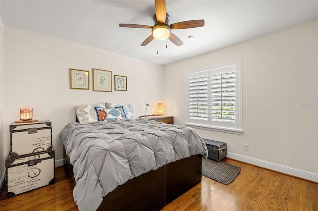 5902 Audubon Manor Blvd, Lithia, FL 33547 - bedroom with wood finished floors, baseboards, and a ceiling fan