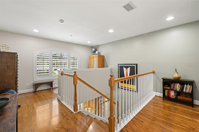 5902 Audubon Manor Blvd, Lithia, FL 33547 - hall featuring an upstairs landing, wood finished floors, recessed lighting, and baseboards