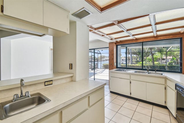 4226 Saltwater Blvd, Tampa, FL 33615 - kitchen featuring a sink, light countertops, light tile patterned floors, and visible vents