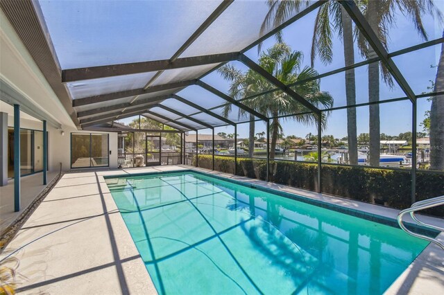 4226 Saltwater Blvd, Tampa, FL 33615 - outdoor pool featuring glass enclosure and a patio