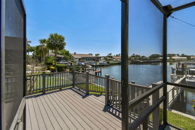 4226 Saltwater Blvd, Tampa, FL 33615 - wooden deck with a water view, boat lift, and a dock