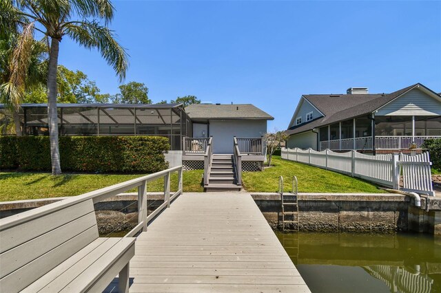 4226 Saltwater Blvd, Tampa, FL 33615 - view of dock featuring a lawn, stairs, and a deck with water view