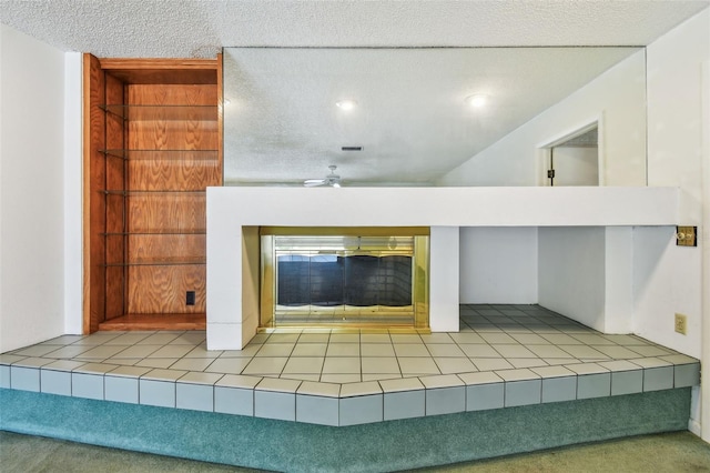 4226 Saltwater Blvd, Tampa, FL 33615 - interior details with a textured ceiling and a tile fireplace