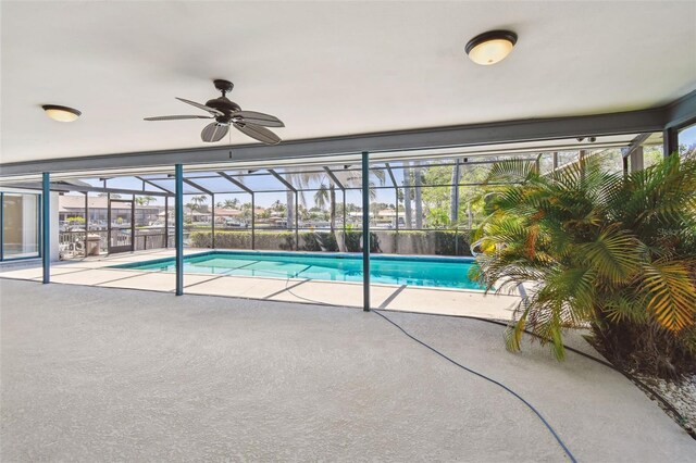 4226 Saltwater Blvd, Tampa, FL 33615 - outdoor pool with a patio, a ceiling fan, and a lanai