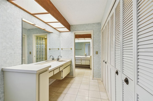 4226 Saltwater Blvd, Tampa, FL 33615 - full bathroom with vanity, tile patterned flooring, a closet, and a textured ceiling