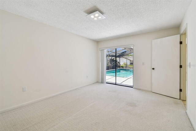 4226 Saltwater Blvd, Tampa, FL 33615 - unfurnished room with carpet floors, a textured ceiling, and a sunroom