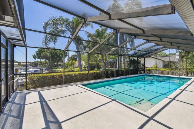 4226 Saltwater Blvd, Tampa, FL 33615 - outdoor pool featuring glass enclosure and a patio