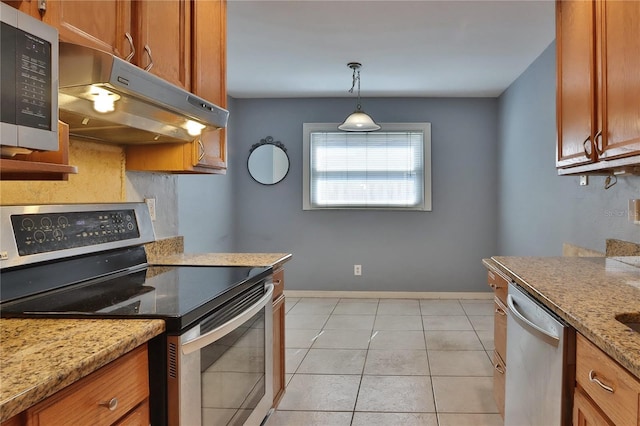 1915 Peppertree Dr, Oldsmar, FL 34677 - kitchen featuring stainless steel appliances, under cabinet range hood, and brown cabinetry