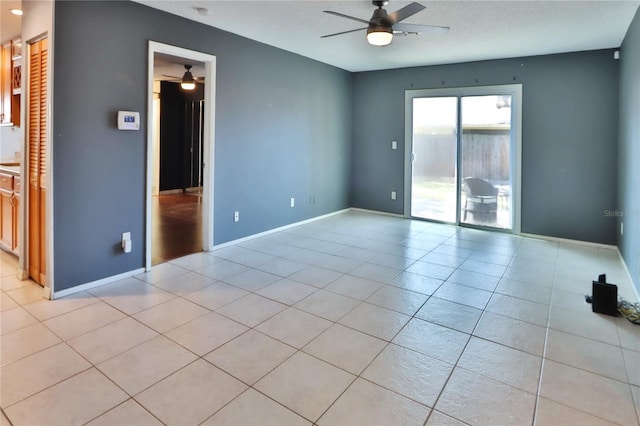 1915 Peppertree Dr, Oldsmar, FL 34677 - unfurnished room featuring ceiling fan, light tile patterned floors, and baseboards
