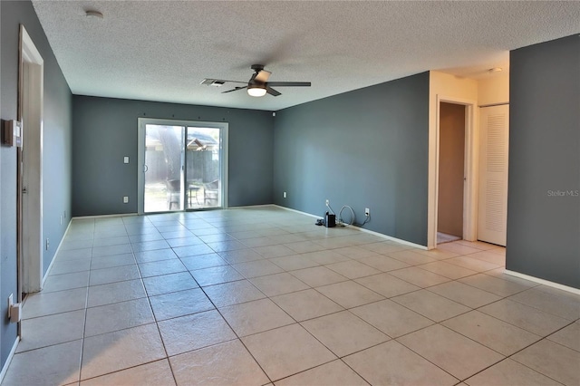 1915 Peppertree Dr, Oldsmar, FL 34677 - spare room featuring ceiling fan, a textured ceiling, light tile patterned floors, baseboards, and a smoke detector