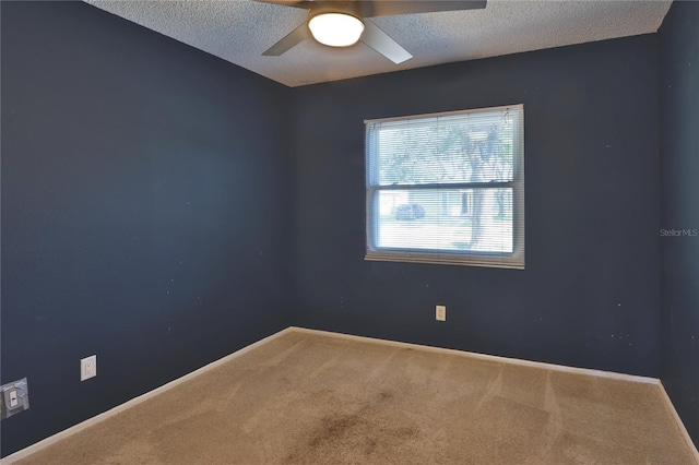 1915 Peppertree Dr, Oldsmar, FL 34677 - spare room featuring carpet flooring, a textured ceiling, a ceiling fan, and baseboards