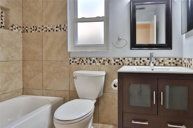 1915 Peppertree Dr, Oldsmar, FL 34677 - full bathroom with tile walls, toilet, a tub, and vanity