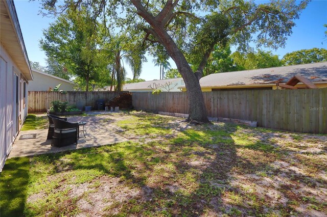 1915 Peppertree Dr, Oldsmar, FL 34677 - fenced backyard with a patio