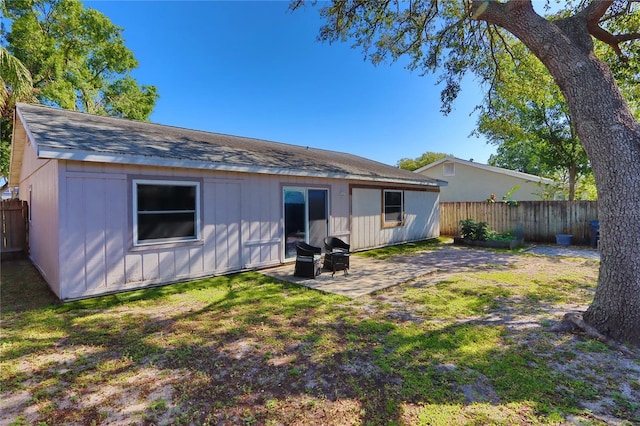 1915 Peppertree Dr, Oldsmar, FL 34677 - rear view of property with a patio area and roof with shingles