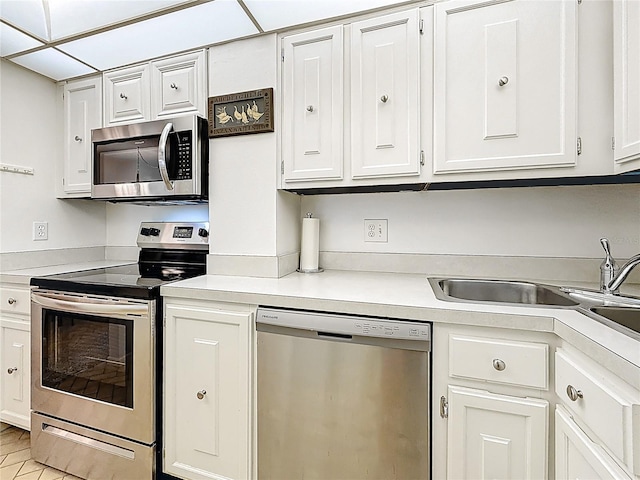 kitchen featuring light countertops, white cabinetry, and stainless steel appliances