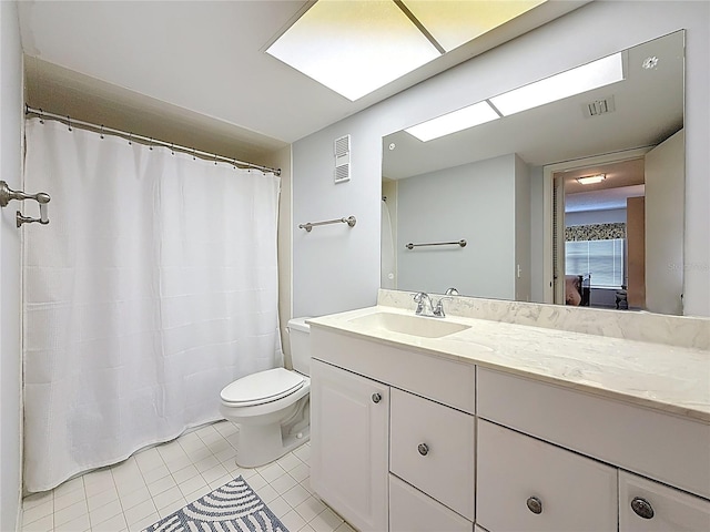 full bathroom with toilet, tile patterned floors, visible vents, and vanity