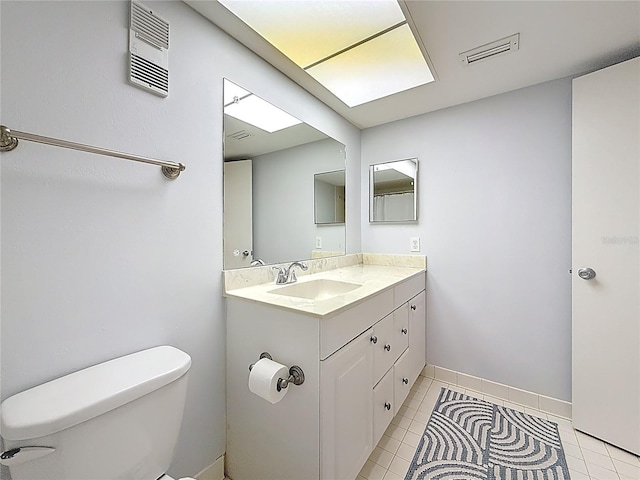 bathroom with visible vents, tile patterned flooring, toilet, and vanity