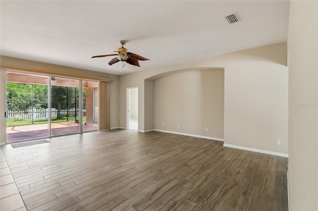 11716 Summer Springs Dr, Riverview, FL 33579 - unfurnished room with ceiling fan, wood finished floors, baseboards, and arched walkways