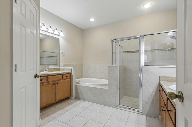 11716 Summer Springs Dr, Riverview, FL 33579 - full bath with tile patterned flooring, vanity, a stall shower, a garden tub, and recessed lighting