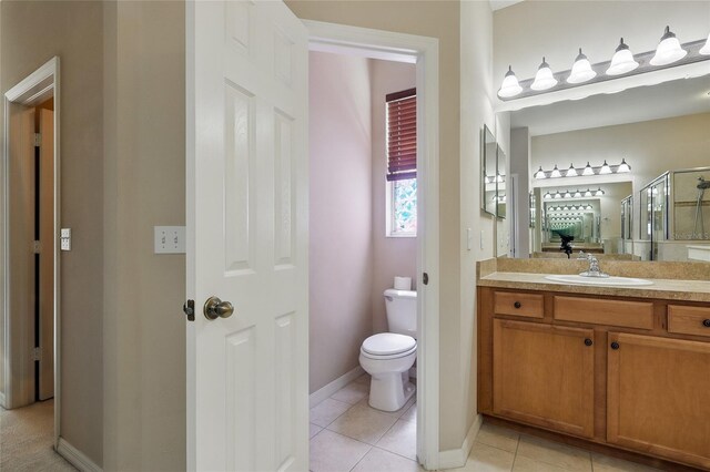 11716 Summer Springs Dr, Riverview, FL 33579 - bathroom with a stall shower, tile patterned floors, toilet, vanity, and baseboards